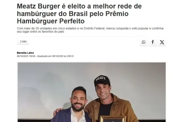Meatz Burger — premiação emoldurada com dois empresários posando